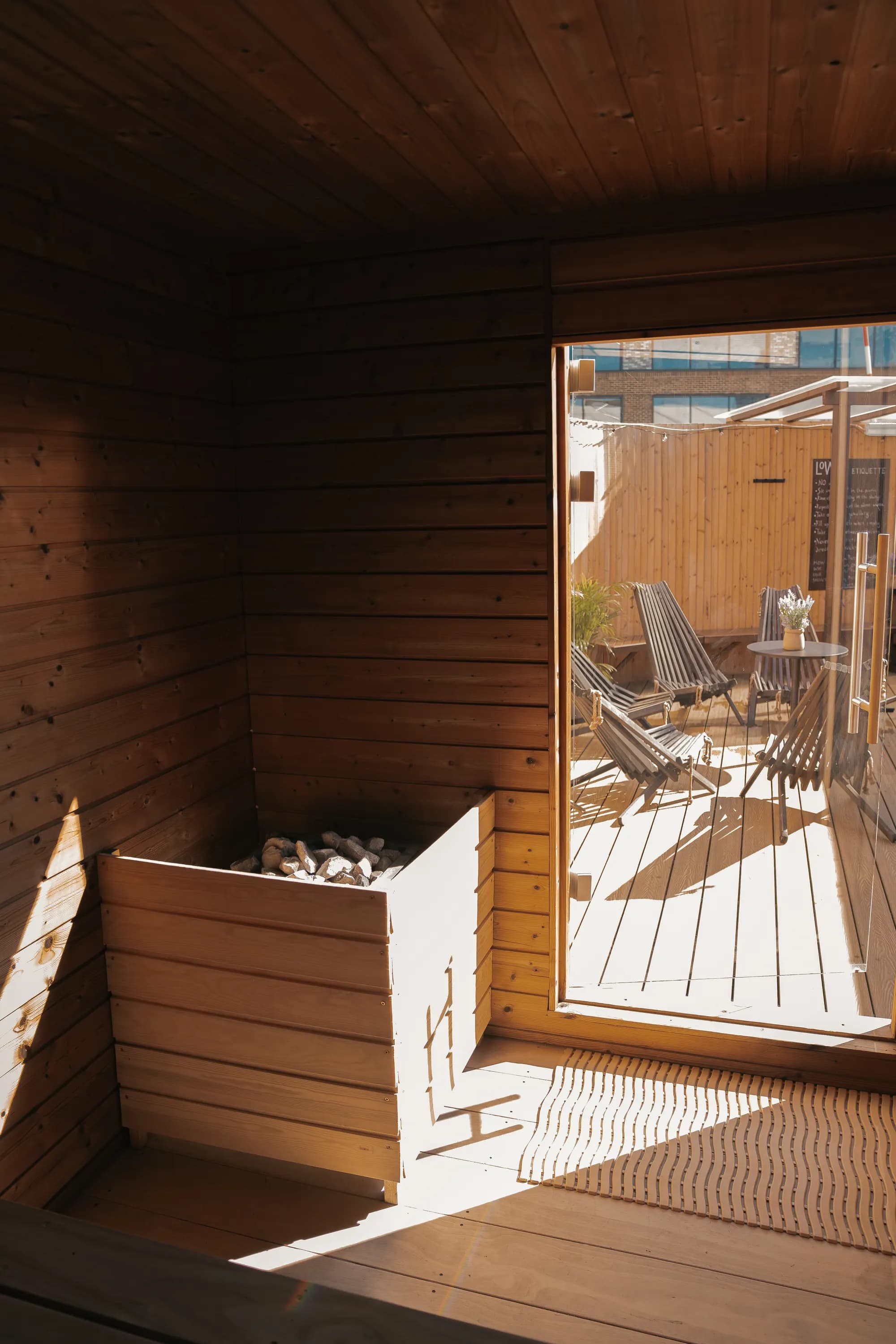 Sauna interior looking out to the sunny deck